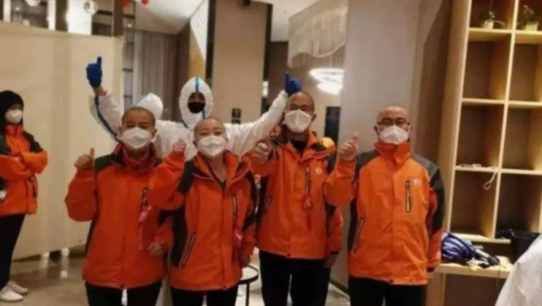 Female medical staff cut hair in virus fight