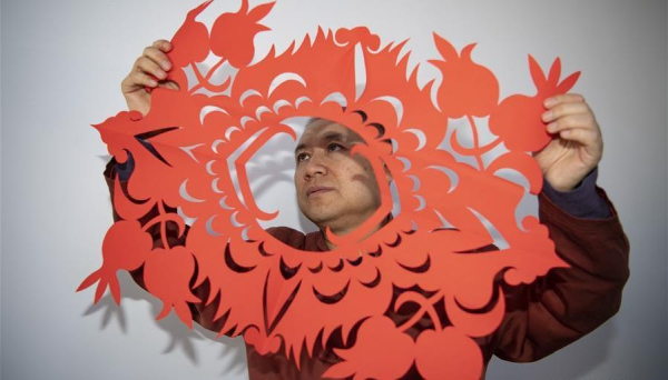 Artist inherits, develops paper-cutting skills