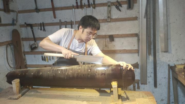 A young man from Huzhou and his Guqin dream with database